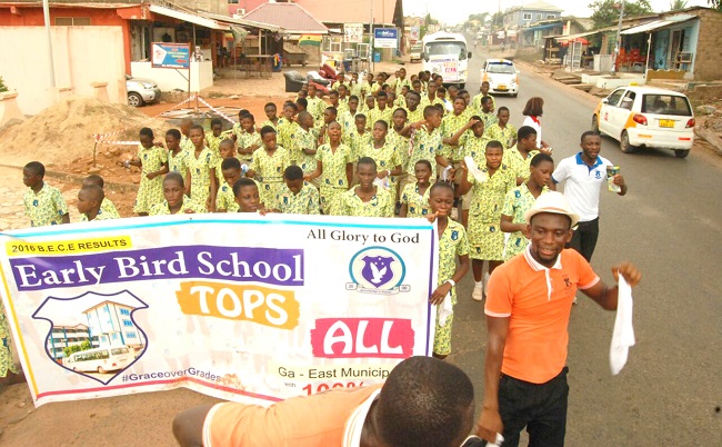 Students of the Early Bird School on a route march to celebrate the school’s achievement